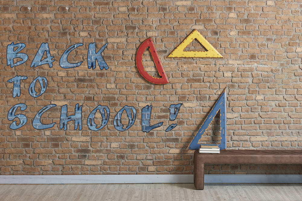 Toile de fond retour à l'école règles mur de briques RR6-29